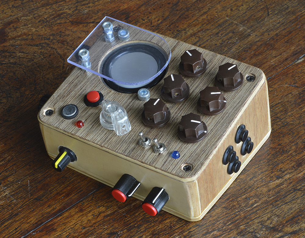 moon canoe fidget - handheld, portable sound synthesiser and looper with brown knobs